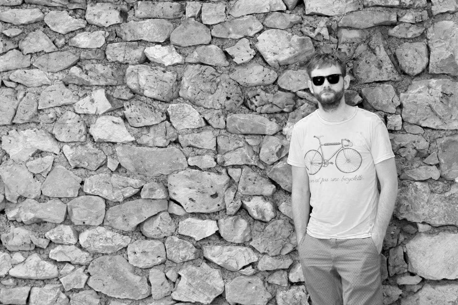 Professional black and white portrait representing authentic coaching approach